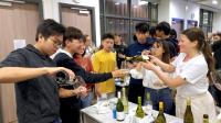 A student helping to serve the wine